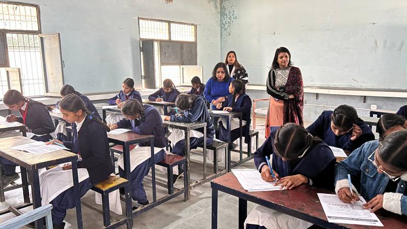 Students writing psychometric test